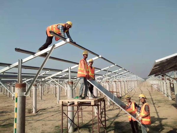 SEDCOL site team assembling a solar mounting structure