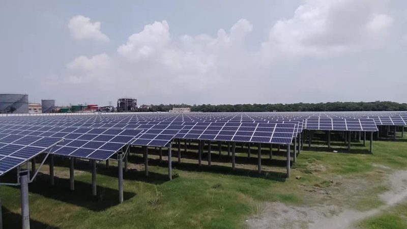 Site team installing solar modules onto a steel mounting structure