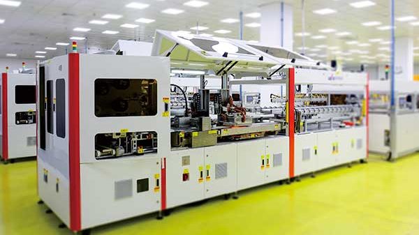 Automated photovoltaic module production line inside a Solarland manufacturing facility